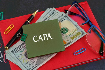 Words CAPA Corrective and Preventive action plans written on a sticker on the background of a...