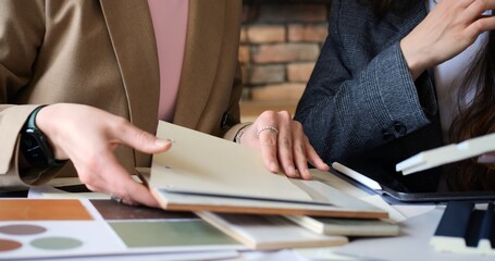 Architectural firm office with team architects collaborating building design project. Reviewing blueprints and discussing construction plans to ensure precise and innovative architectural solutions.