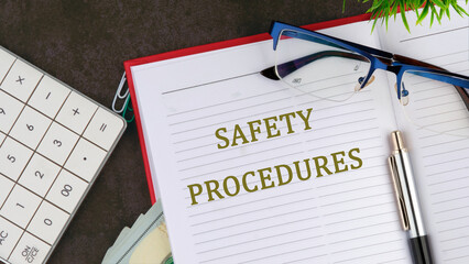 Safety Procedures concept. SAFETY PROCEDURES written on the open page of the business notebook next...