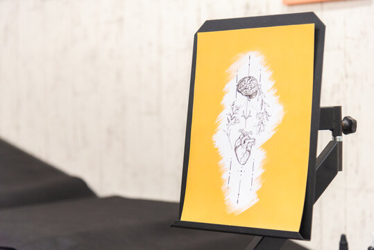 Brain and Heart Tattoo Design on Display Stand