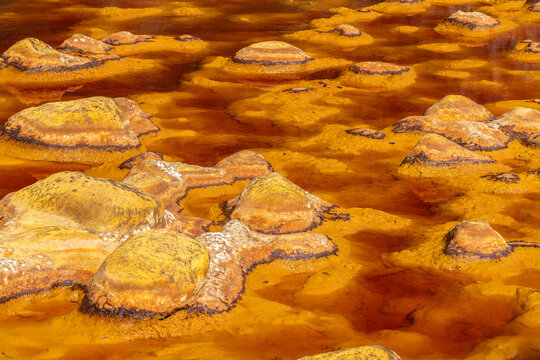 Mineral-rich riverbed in Riotinto with vivid warm hues