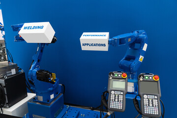 Robot arms on a blue background. Smart industry concept..