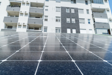 Solar panels near an apartment building.
