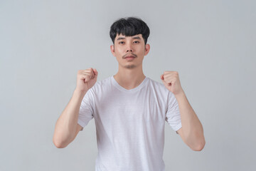 Handsome young man showing his hands gestures.