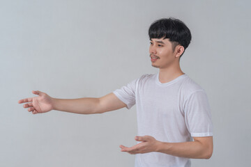 Handsome young man showing his hands gestures.