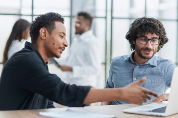 Business professionals in a meeting, collaborating, communicating, and displaying positive teamwork.