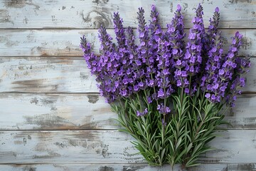 A bunch of purple flowers are arranged on a wooden surface