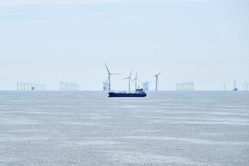 construction of a wind farm on the North Sea with a ship in the foreground