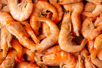 Frozen, boiled shrimp. Texture King prawns background. Seafood on the counter. Fish market....