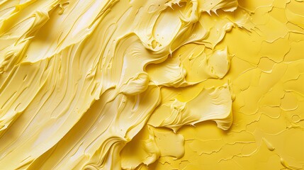 A background of yellow oil paint, with soft and smooth brush strokes creating an abstract pattern. The texture is rich in detail, showcasing the unique quality of the paint.