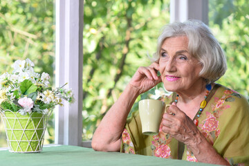 Portrait of a beautiful woman in the park in summer