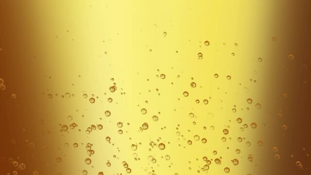 Bubbles float around the golden beer getting poured into a glass, 4K, Loop