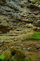Russia, the North Caucasus. View of the shady mossy rocks near the waterfall Adai-Su (maiden spit) in the Chegem gorge of Kabardino-Balkaria.