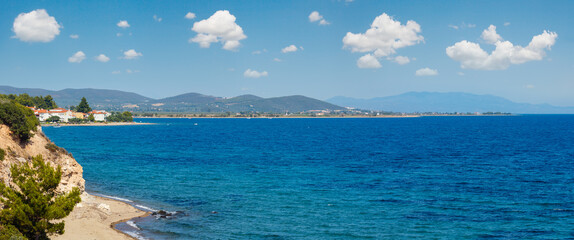 Summer sea coastline scenery with sandy beaches (Sithonia, Halkidiki, Greece). People are...