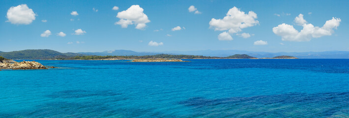 Aegean sea coast panorama and Karidi or Karydi beach (Chalkidiki, Greece). Six shots stitch high-resolution panorama. People unrecognizable.