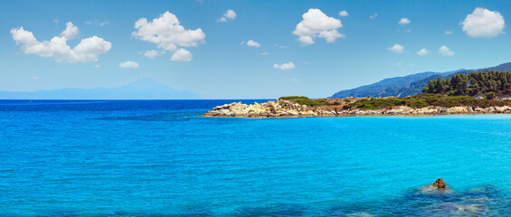 Aegean sea coast panorama and Karidi or Karydi beach (Chalkidiki, Greece). Six shots stitch high-resolution panorama. People unrecognizable.