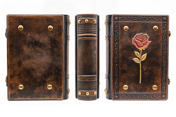 Worn brown leather book with rose on the cover.