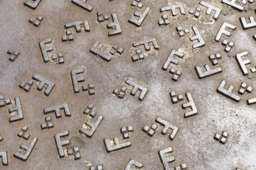 Group of Metal Letters on Metal Surface