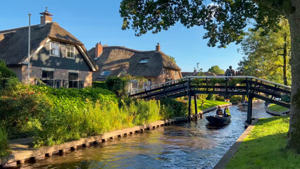Traditional dutch houses, gardens and water canals and wooden bridges in village is know as Venice...