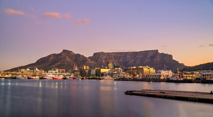 victoria & alfred v&a waterfront and table mountain in the background during sunset, Cape Town,...