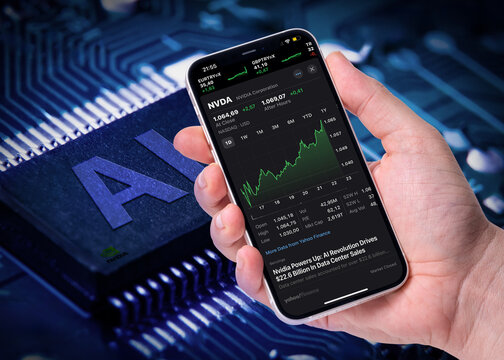 Antalya, Turkey - May 26, 2024: NVIDIA's stock prices on the iPhone screen and the AI with the nvidia logo on the computer processor behind it