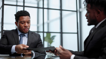 two African Americans signed a cooperation agreement.