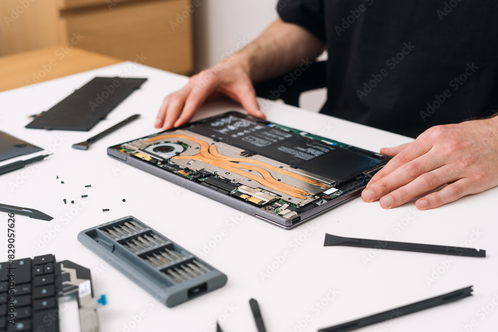 Poster man assembling and upgrading personal computer or laptop