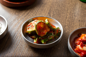 A view of a side of Korean banchan spicy marinated cucumbers, known as oi muchim.