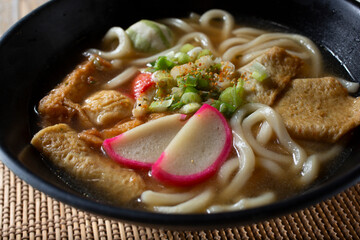 A closeup view of an udon noodle soup.