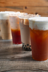 A view of a row of milk tea drinks.