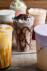 A view of a cookies and cream smoothie, among several other milk tea drinks.