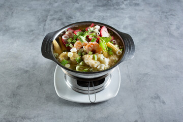A view of a bowl of wonton soup, Thai style.