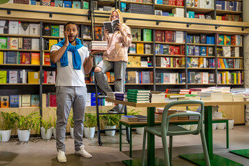 Young people at the library searching for interesting books