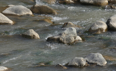 river in north Pakistan, stones in the flowing river HD photo