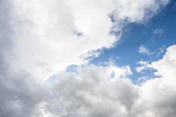 Obraz premium Dramatic sky of dark with blue bright white and gray clouds as a nature background 