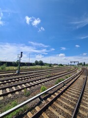 railways with blue sky, clouds and sunbeam in Berlin Tempelhof (Germany/Europe)