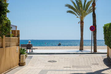 View to Albir seaside beach and Mediterranean Sea from Albir street. Albir is stylish modern...
