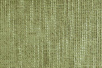 Jacquard woven coarse weave texture upholstery khaki fabric. Textile background, furniture textile material, wallpaper, backdrop. Cloth structure close up, macro.