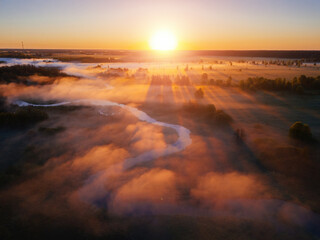 Sunrise and morning mist at countryside, aerial view