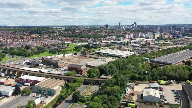 Aerial footage of the village of Kirkstall just outside the city centre of Leeds in the West Yorkshire UK showing the ITV Television Studios on a hot sunny summers day