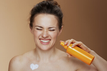 happy young woman with cosmetic cream jar