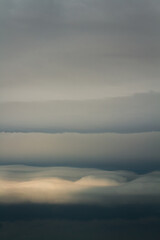 Ominous storm clouds hang in the sky, ready to release rain.