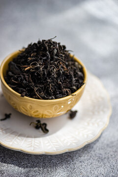Close-up of a Ceramic bowl filled with loose leaf tea on a table