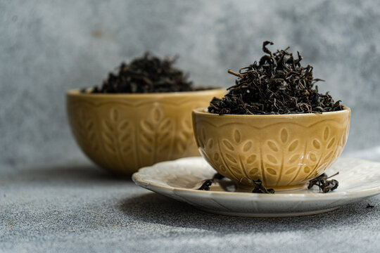 Close-up of a Ceramic bowl filled with loose leaf tea on a table