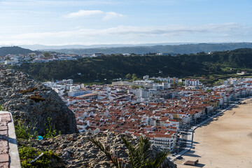 View from the hill to the sandy beach 'Praia da Nazaré' , Praia do Norte beach and Nazare town, Portugal