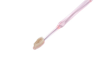 Pink toothbrush on white background