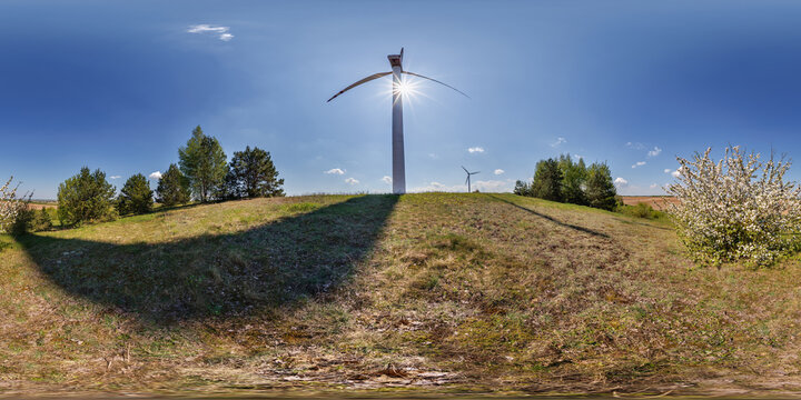 360 hdri panorama view near huge windmill propeller in full seamless spherical  equirectangular projection, VR AR virtual reality content. Wind power generation. Pure green energy.