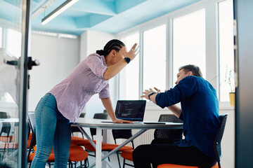 A furious business director of a startup office berating her employee for business mistakes and...