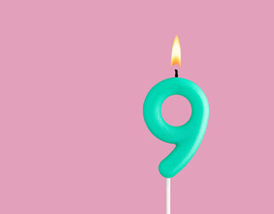 Green candle number 9 - Birthday card on pastel pink background