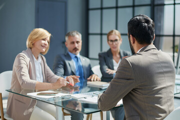 Fototapeta premium Multicultural professionals project managers group negotiating in boardroom at meeting.